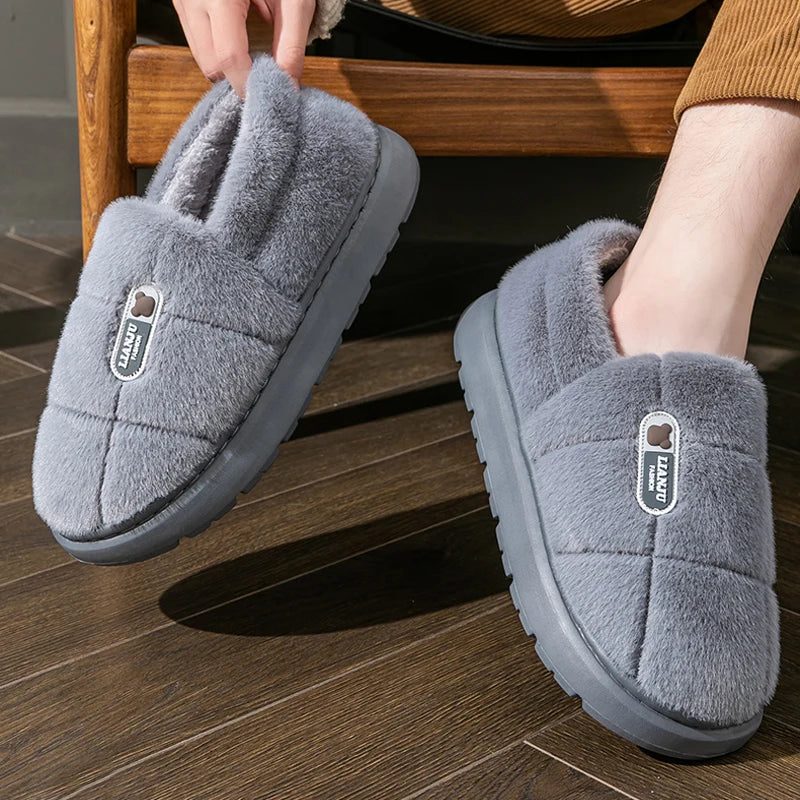 Pulling on a Grey Quilted Plush Slipper